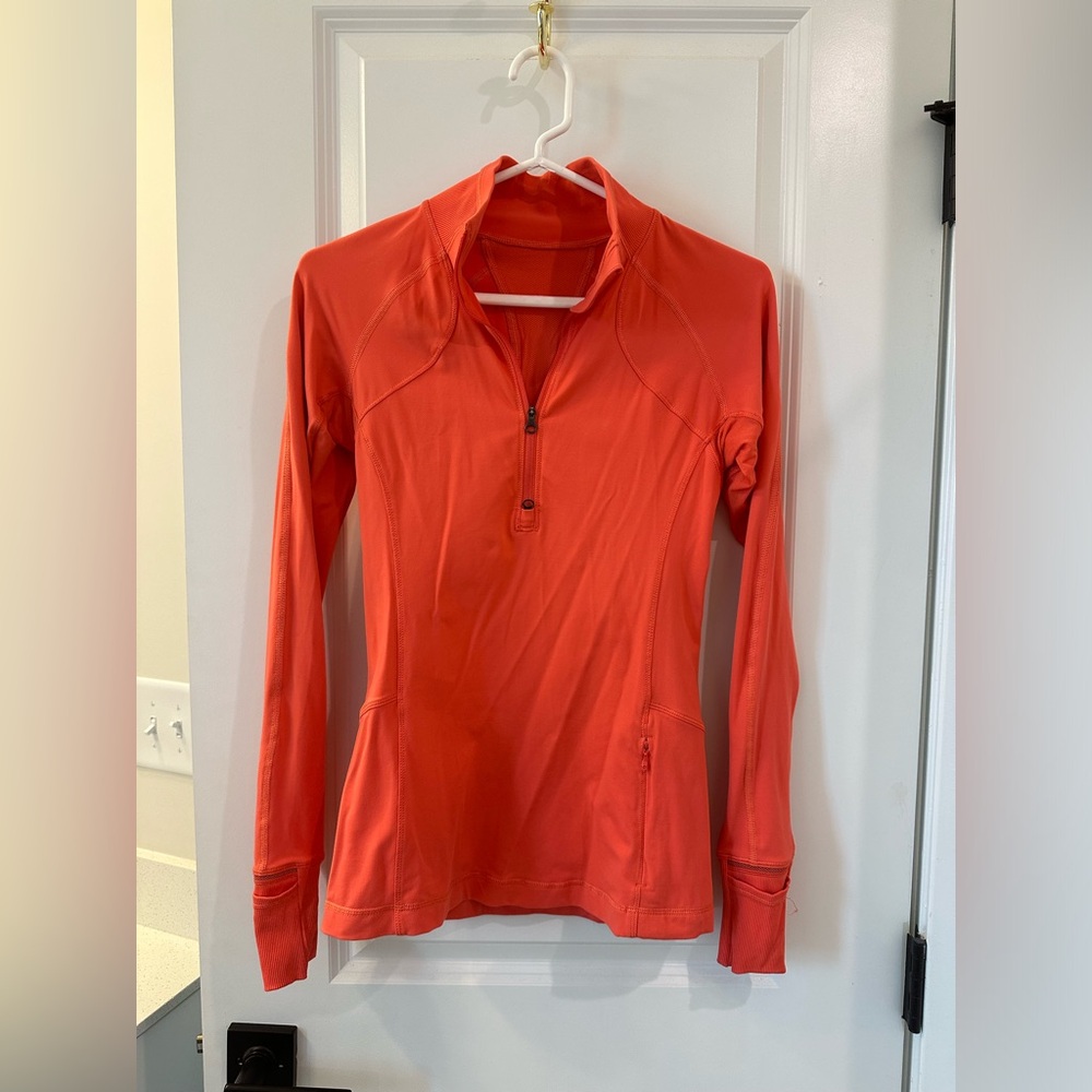 Half orange zip up lululemon sweatshirt. Size 6.